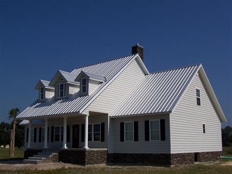 white metal roof on white house|white house with galvalume roof.